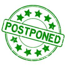 Grunge green postpone round rubber seal stamp on white background